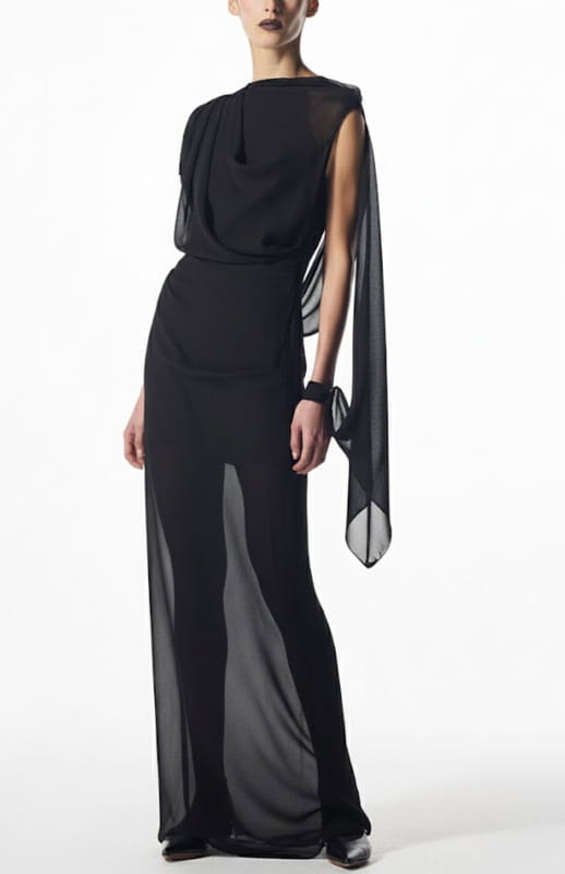 model is wearing long draped silk chiffon gown in black