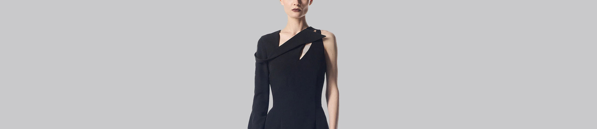 Asymmetrical black dress.