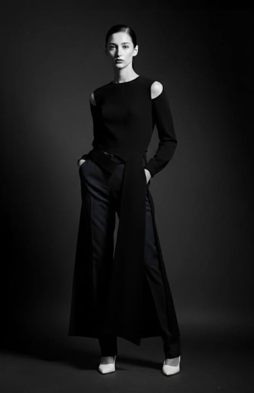 model wearing a long black top with tails