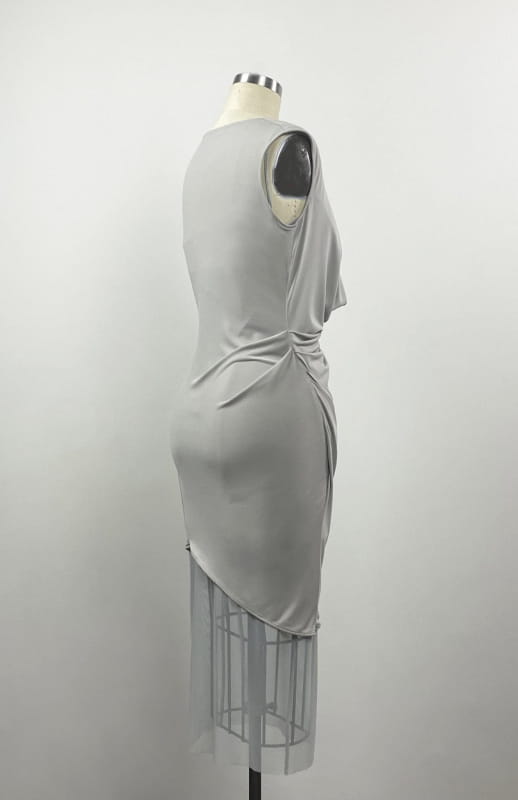  Short, Grecian style, draped, knit dress, in taupe color jersey knit, worn over a sheer, midi, mesh slip