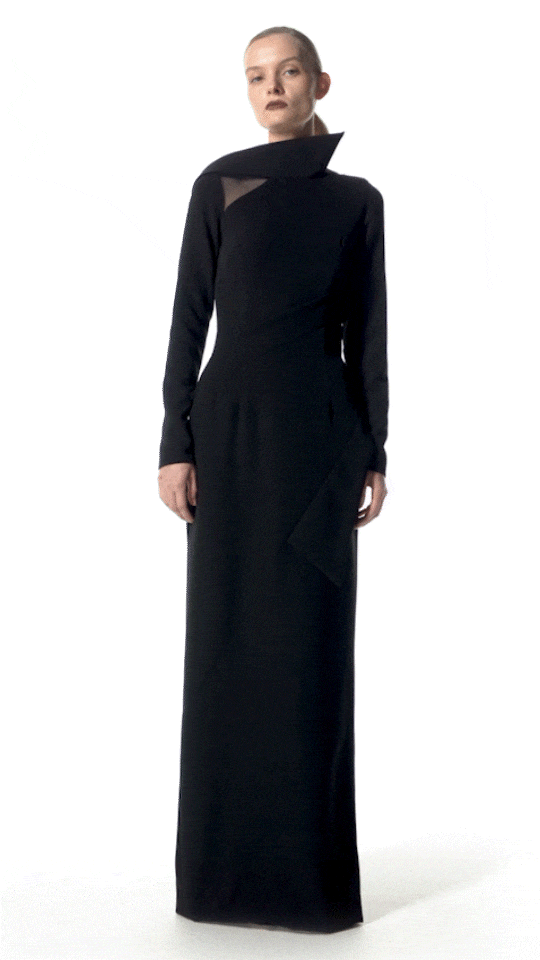 model wearing Damaris long evening dress walking elegantly in long black gown