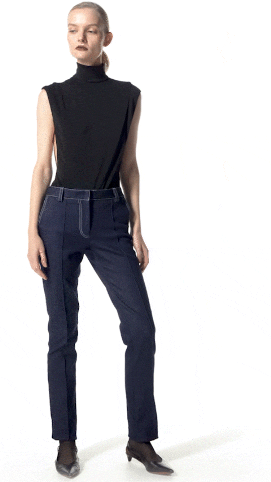 model wearing Deya turtleneck bodysuit with Norias jeans