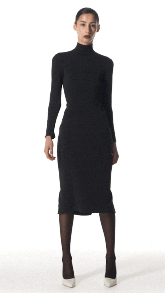 model wearing Kore pencil skirt walking to showcase fit