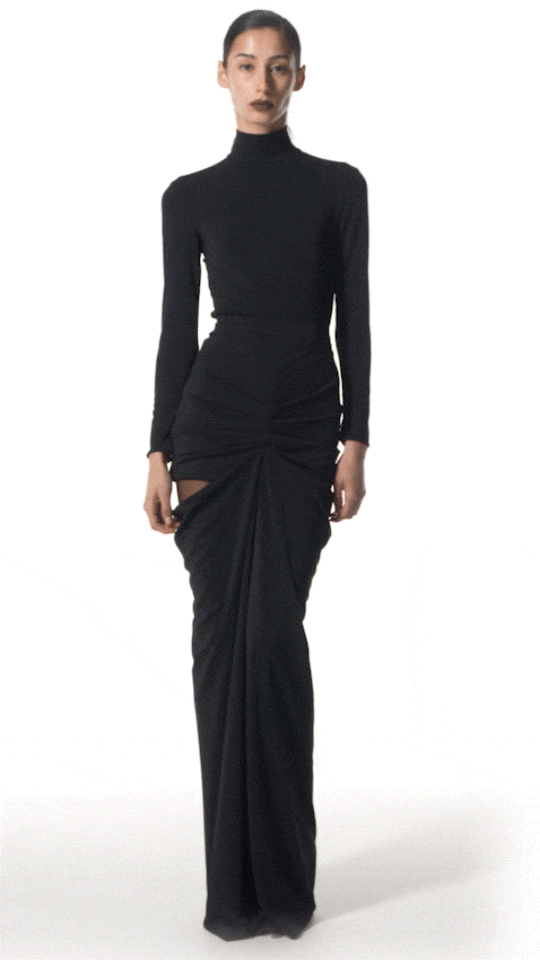 model wearing Niote long draped skirt walking to show fluid drape