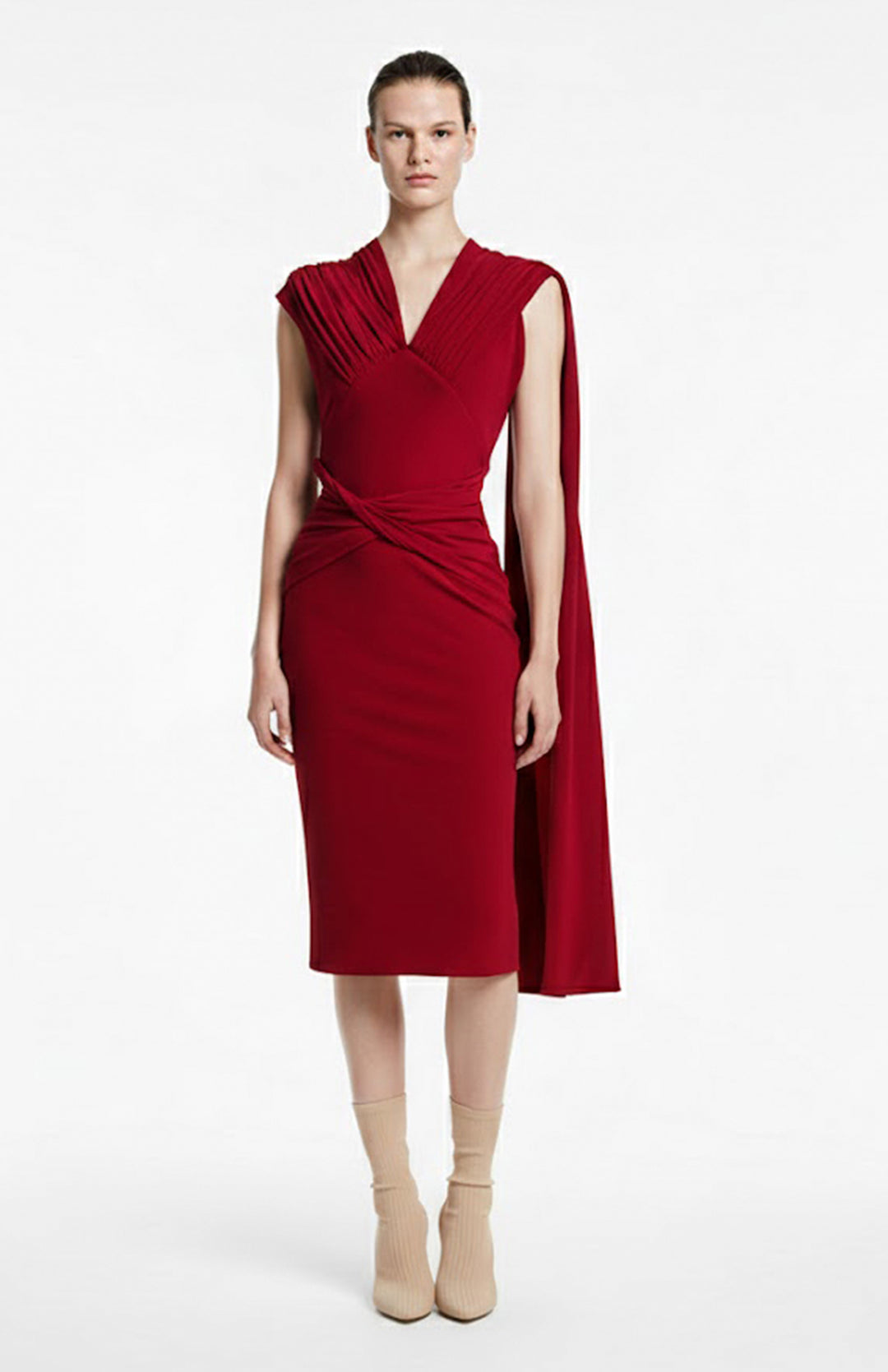 Model wearing draped red jersey dress