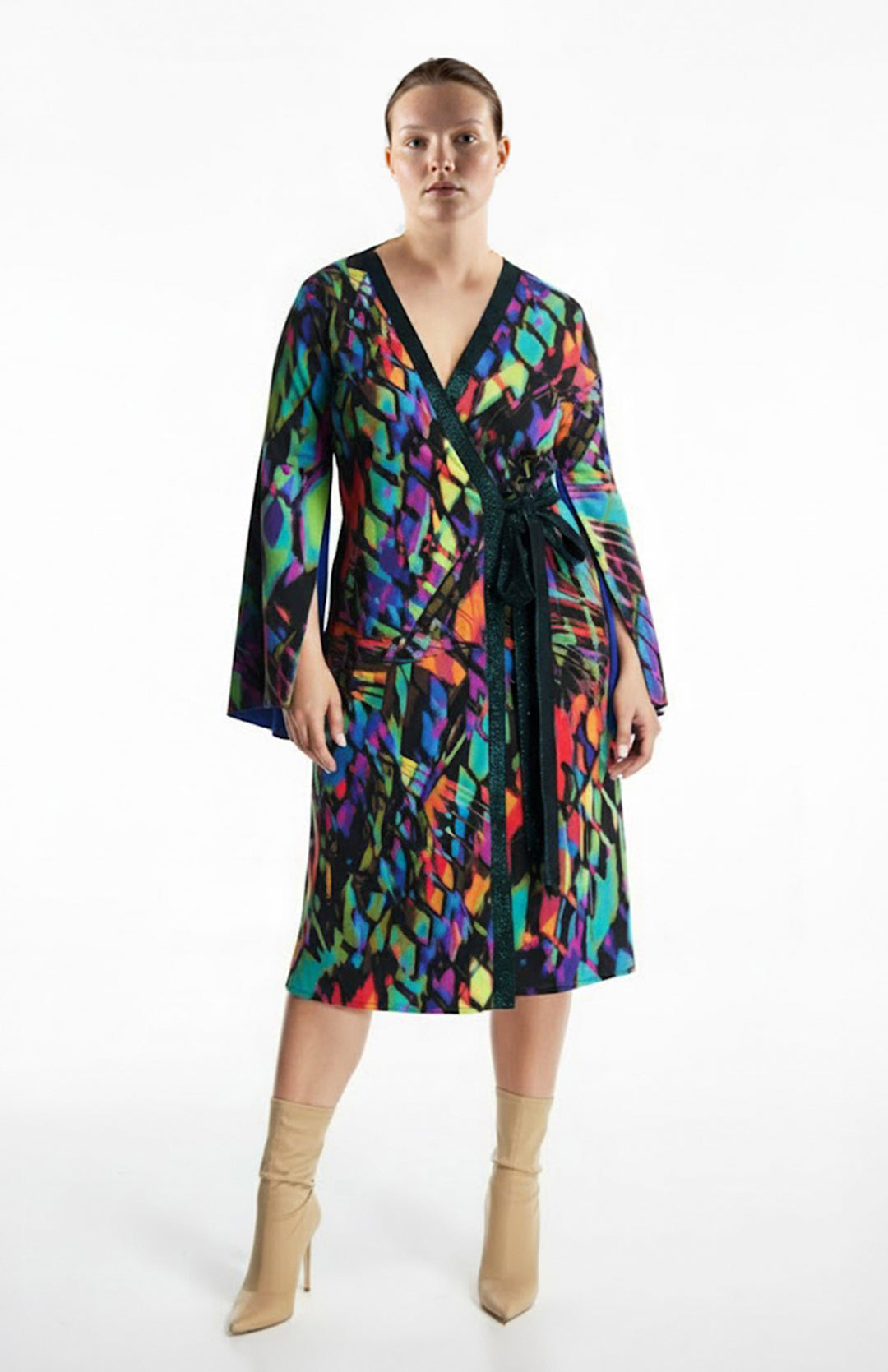 plus size model is wearing a printed wrap jersey dress