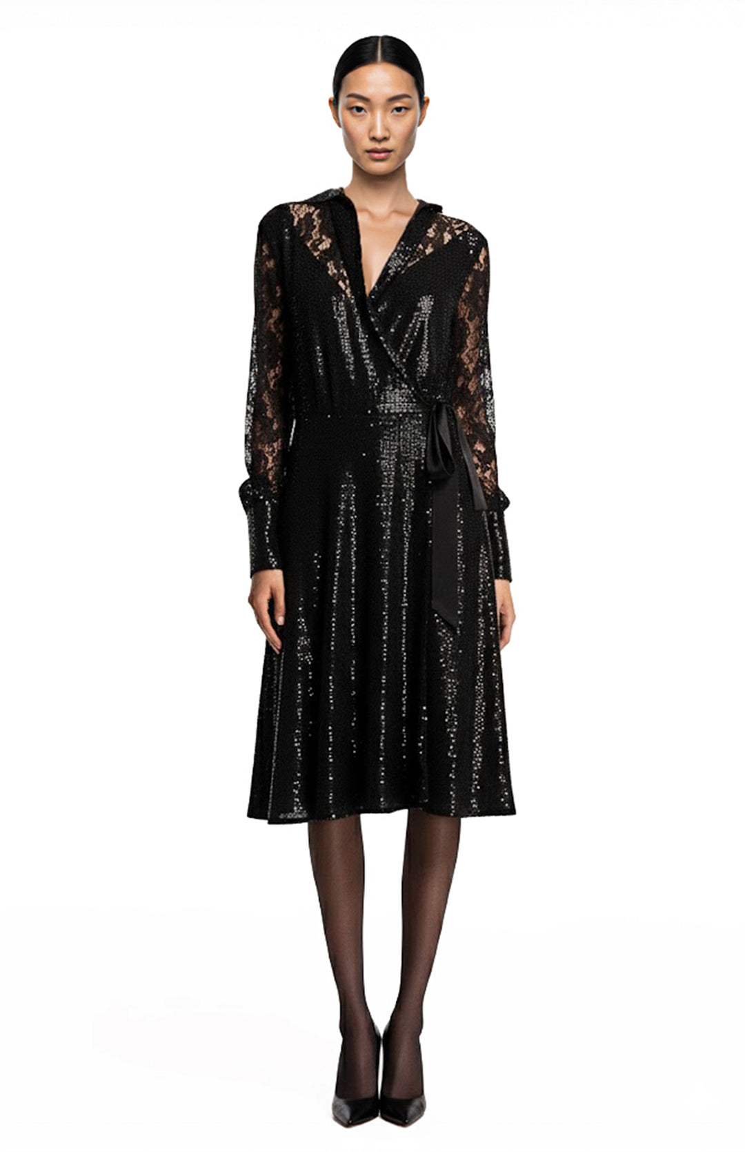 model wearing black sequin wrap dress
