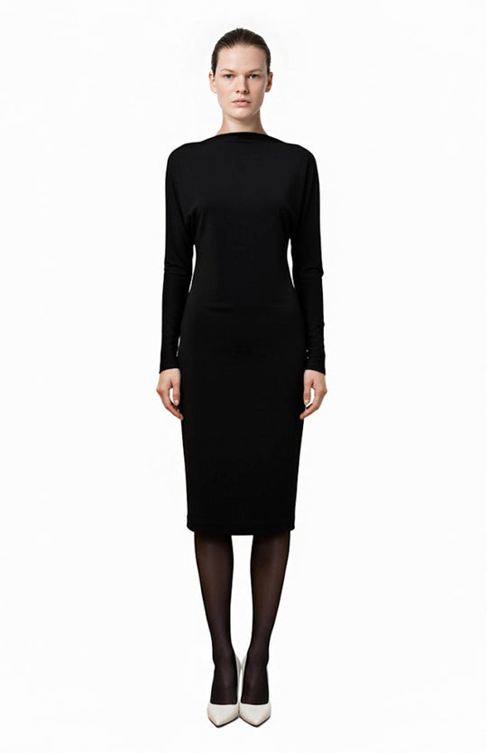 model wearing knee length black cocktail dress