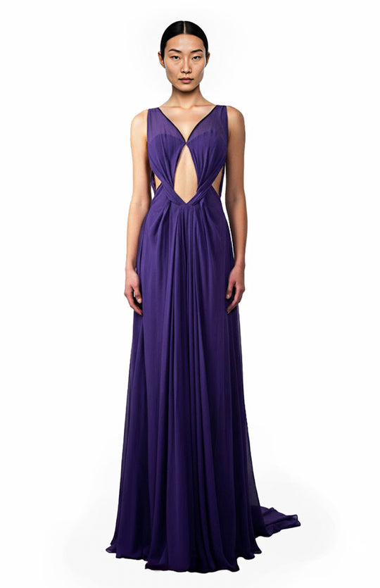 model wearing a long purple grecian draped silk gown