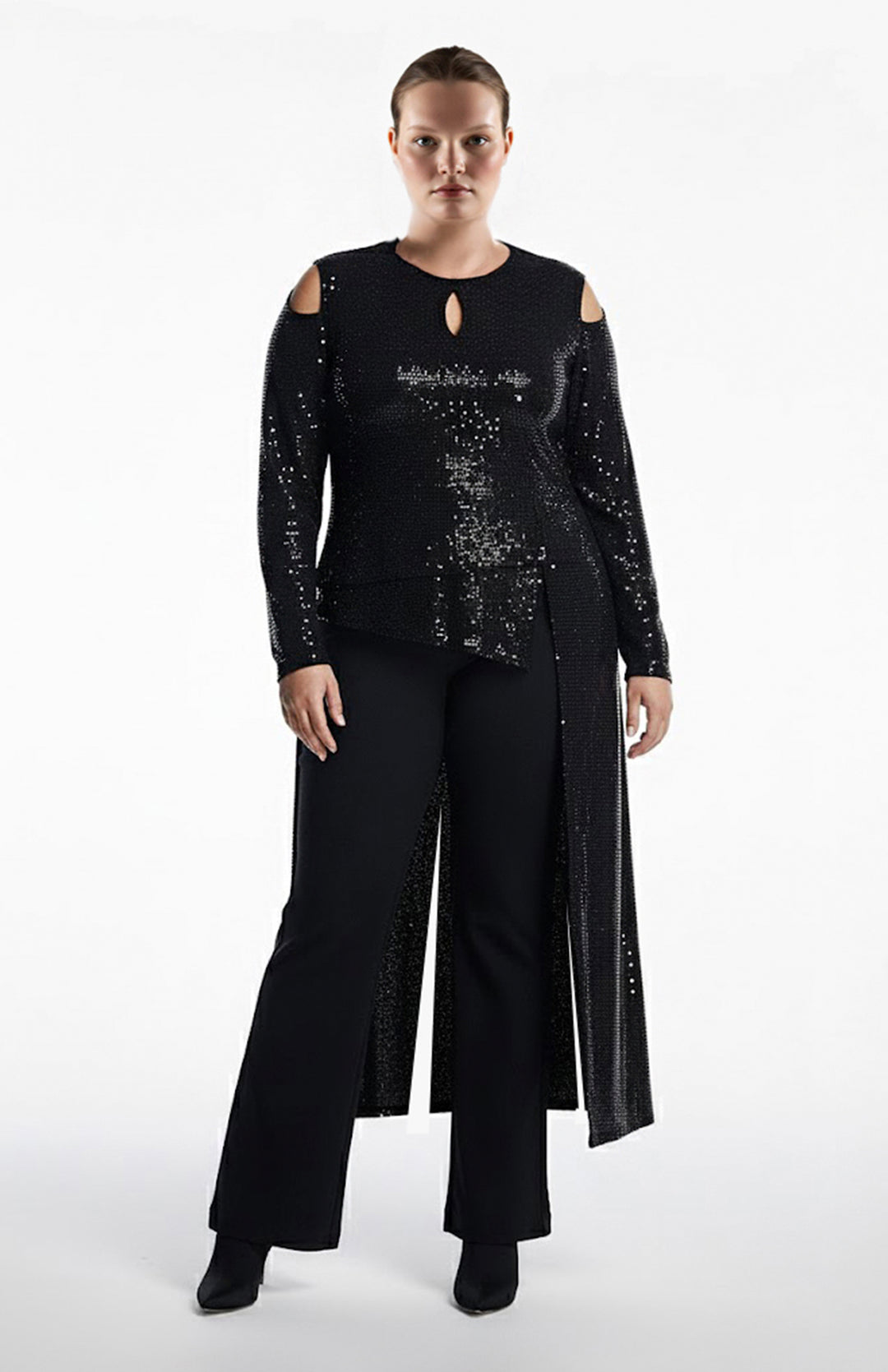 plus size moder wearing black sequin top and pants