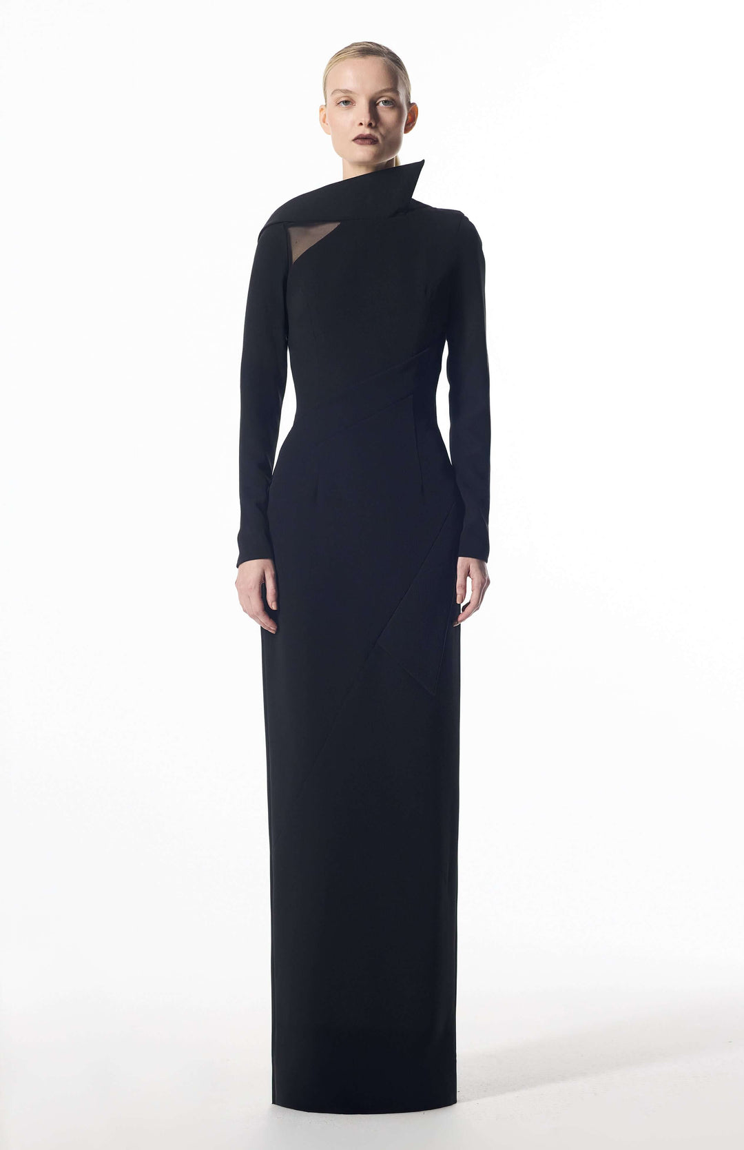model wearing Damaris long evening dress walking elegantly in long black gown