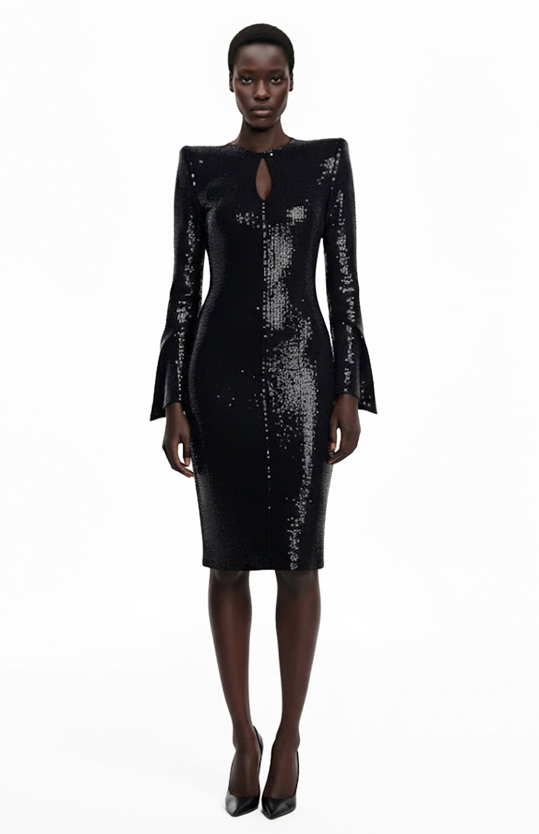 Black model wearing knee length black sequin dress with sleeves