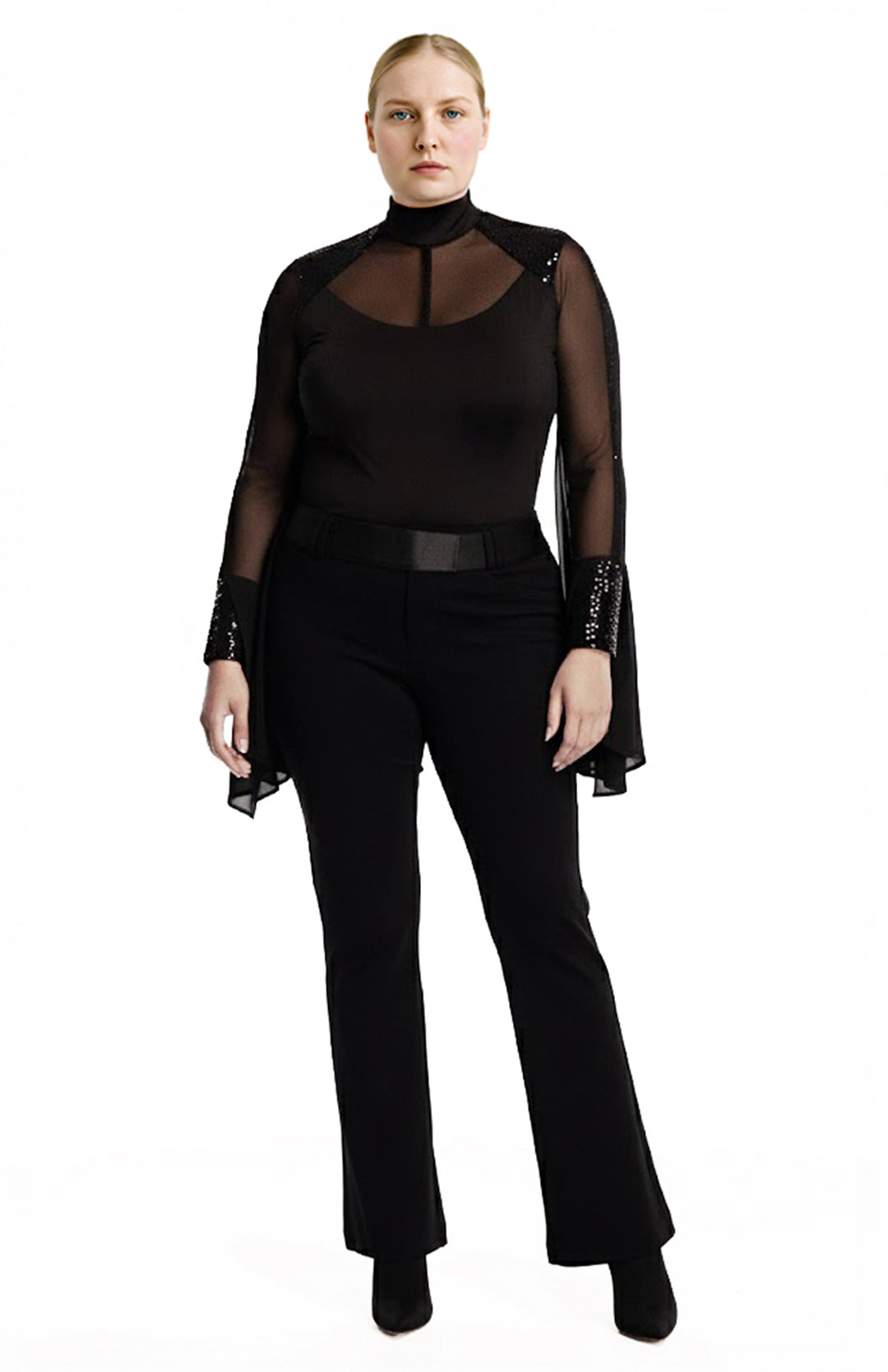 Plus size model is wearing a black draped bodysuit and black pants