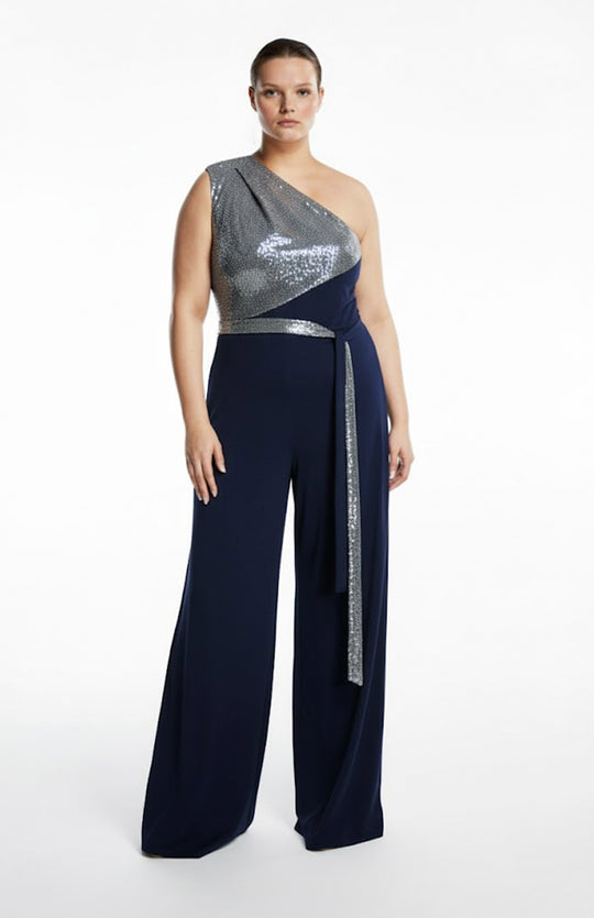 plus size model wearing one shoulder jumpsuit