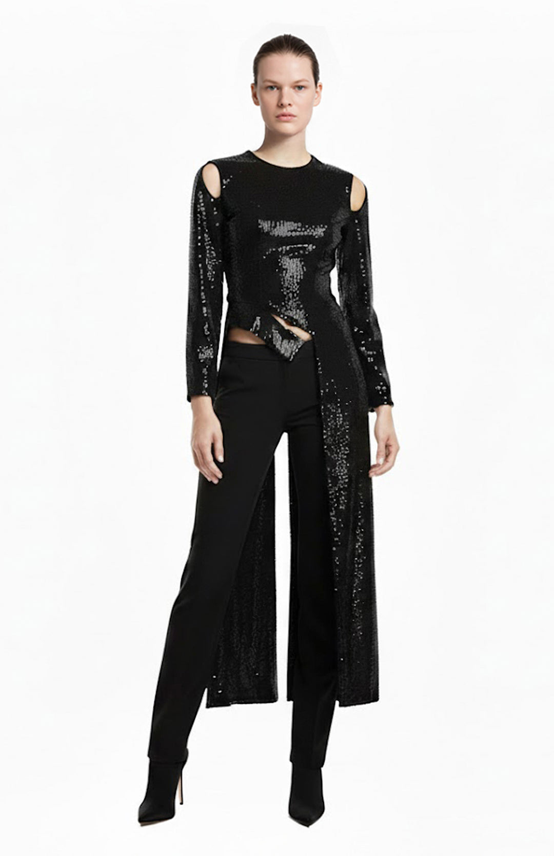 Model wearing black sequin top with long tails and black pants