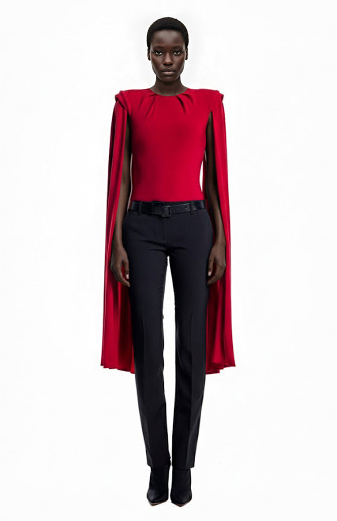 model wearing a red bodysuit with cape sleeves