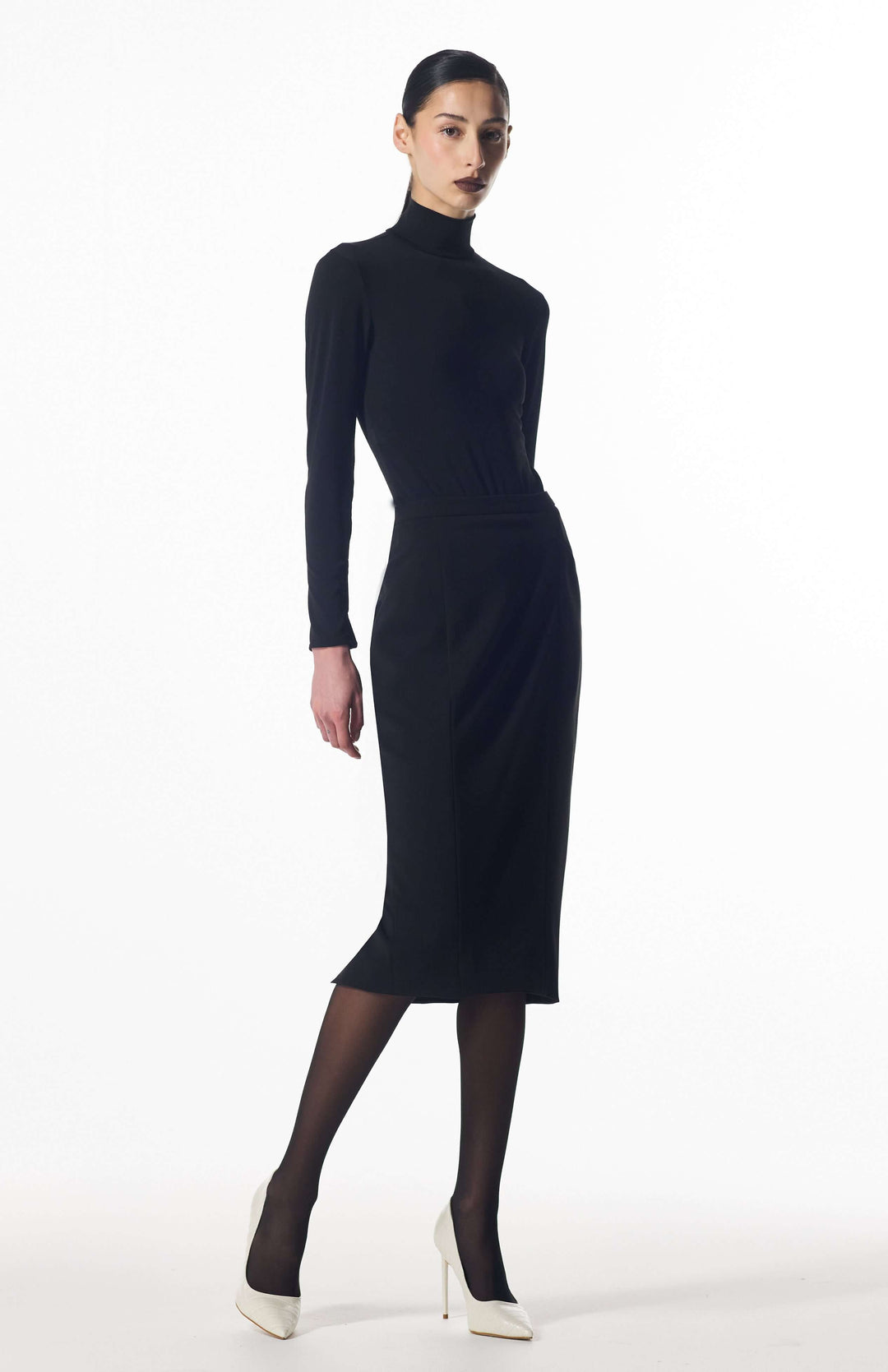 model wearing Kore pencil skirt walking to showcase fit