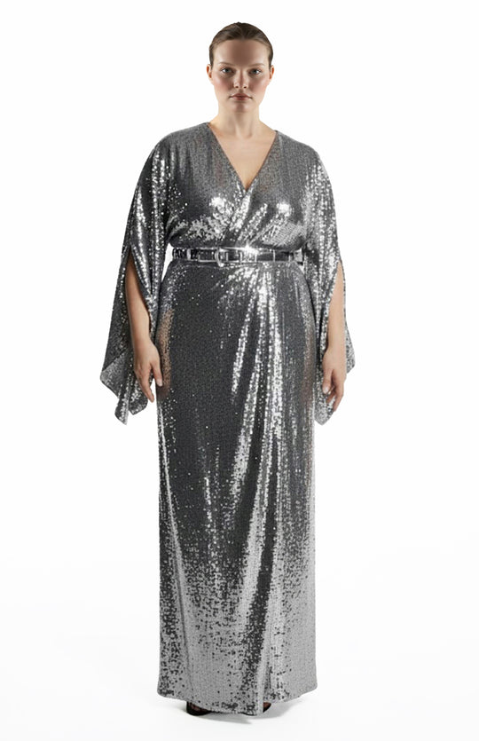 plus size model is wearing a long silver sequin wrap gown 