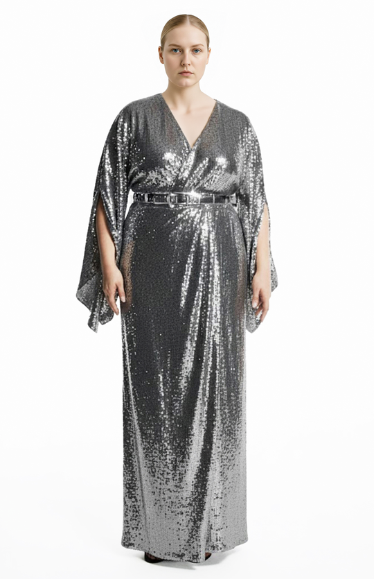 plus size model is wearing a long silver sequin wrap gown 