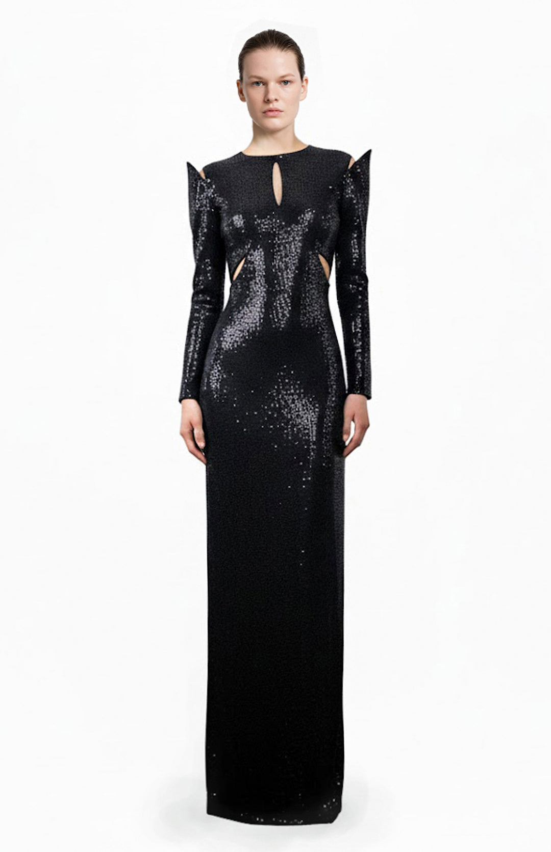 Model wearing a long black sequin gown with cutouts