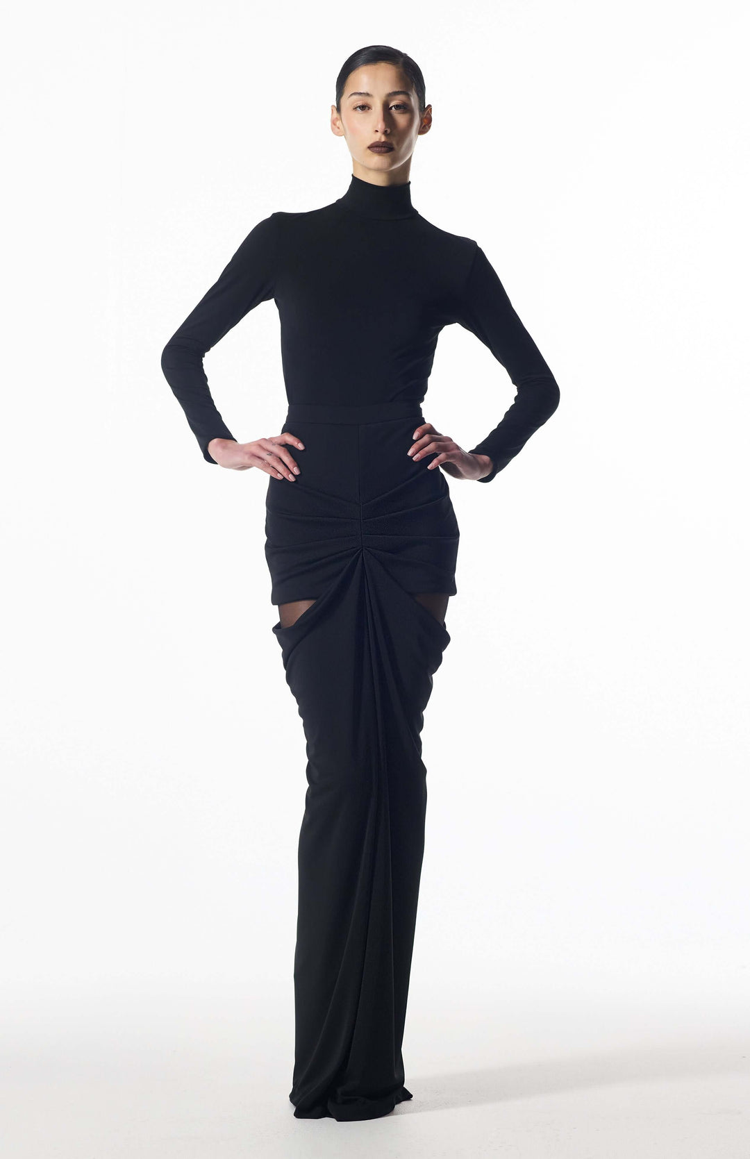 model wearing Niote long draped skirt walking to show fluid drape