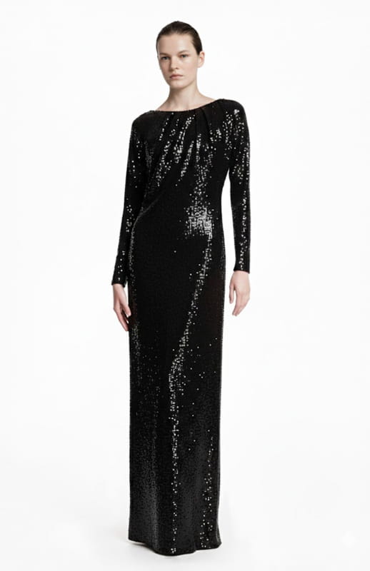 model wearing a long black sequin dress