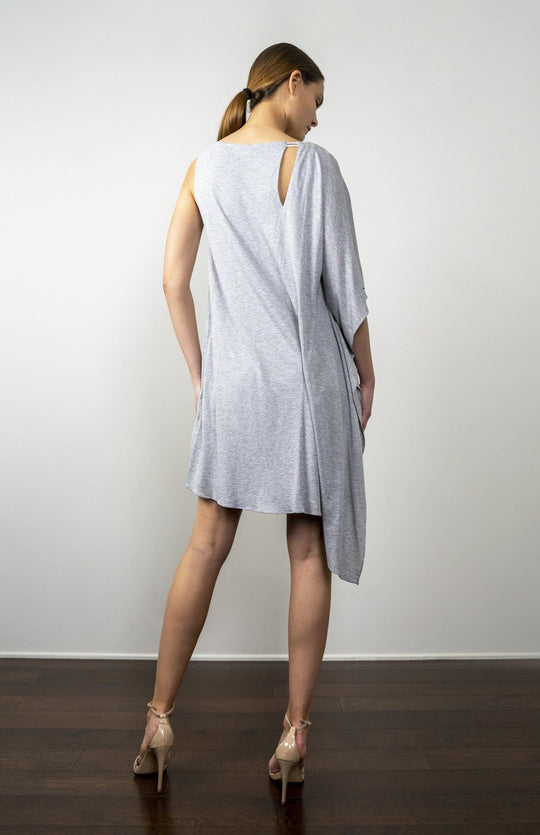 Sexy chic,smart casual, asymmetrical sleeve, asymmetrical hem,  short, kimono style dress in lux heather grey jersey knit. With back slash detail. Fully lined.