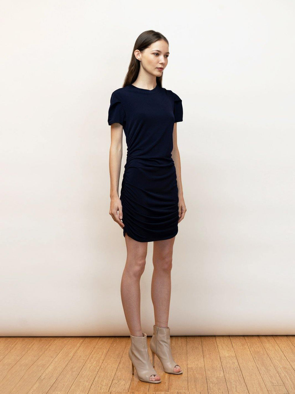 Chic, navy, short sleeve, smart casual tee dress in jersey knit. Body gathers and draped sleeves.