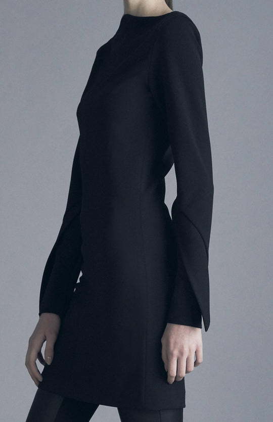Close up of, Chic, black, long sleeve short fitted dress, with high neck, long sleeves, made in stretch crepe.