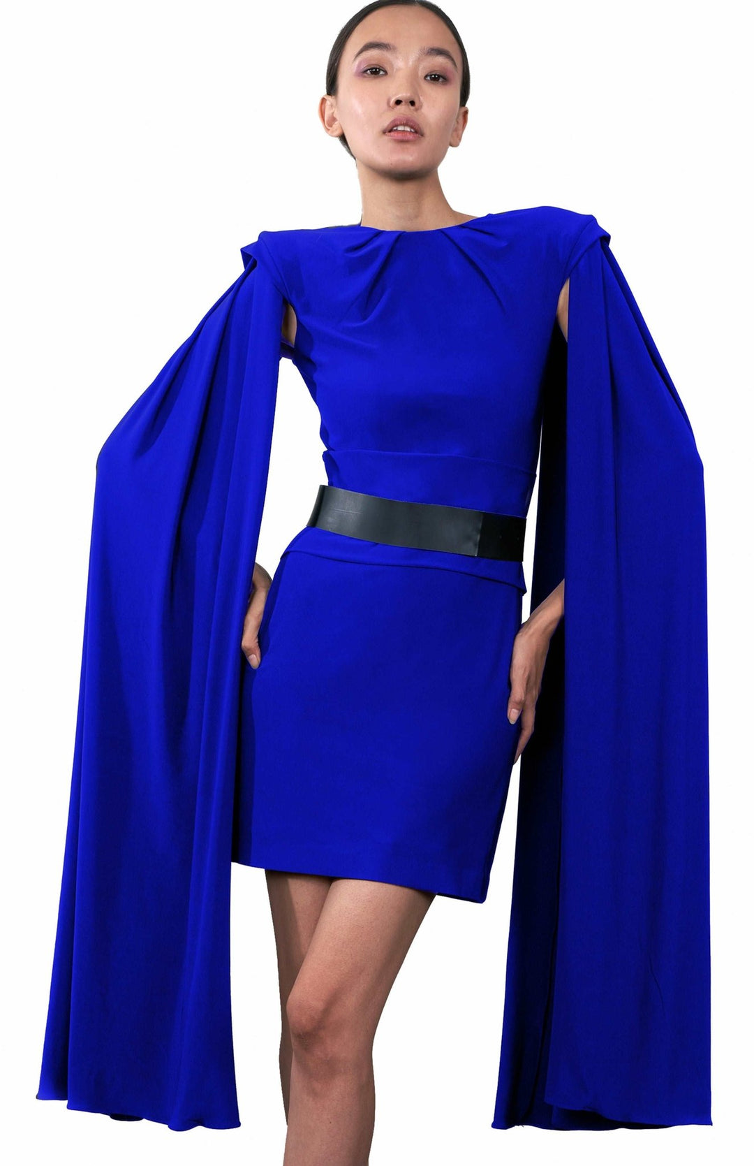  Short, electric blue ,cape sleeve dress in jersey knit with shoulder pads and pleated detail.