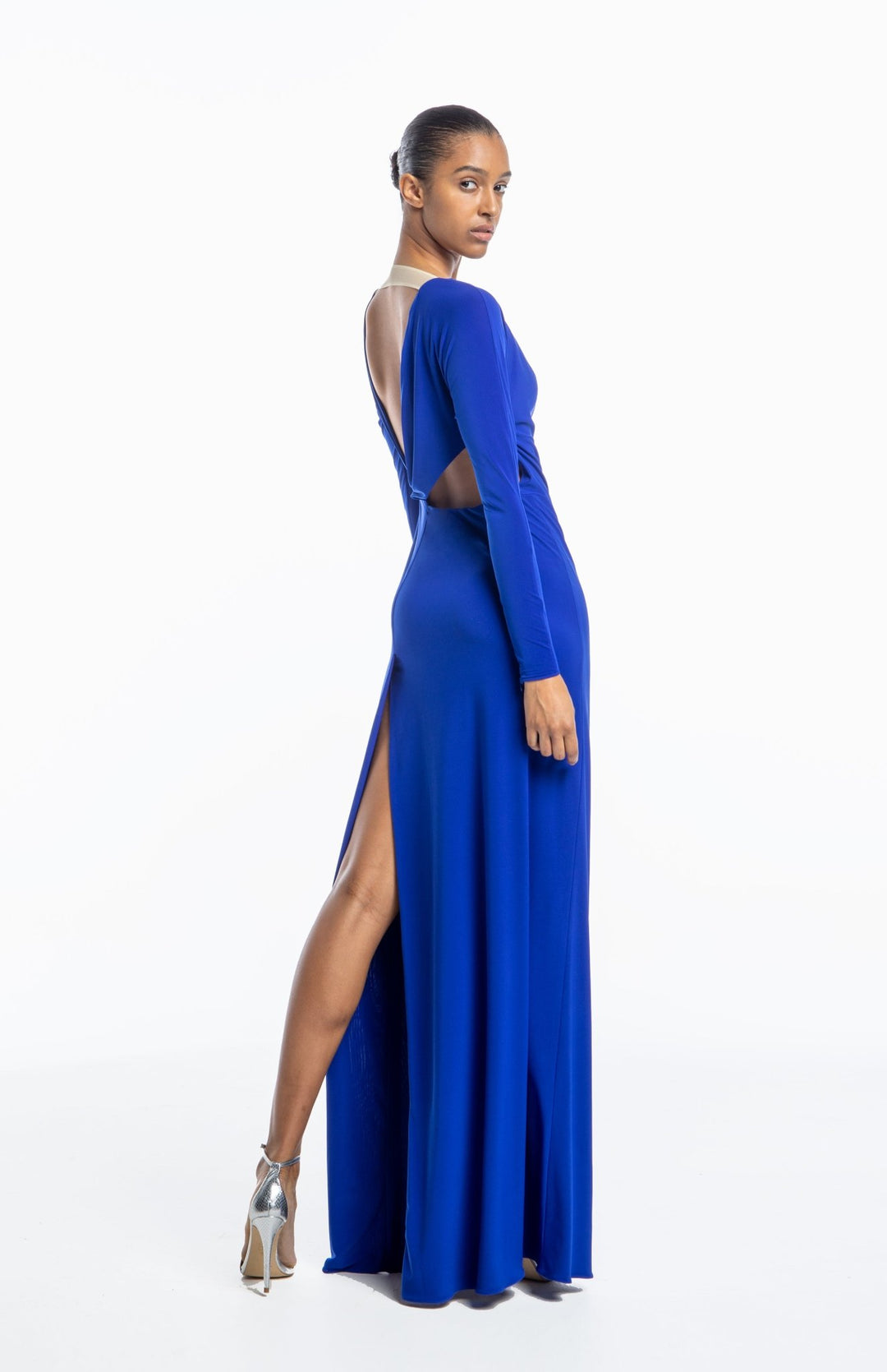 Grecian style, backless gown, with back cutout detail in royal blue jersey knit