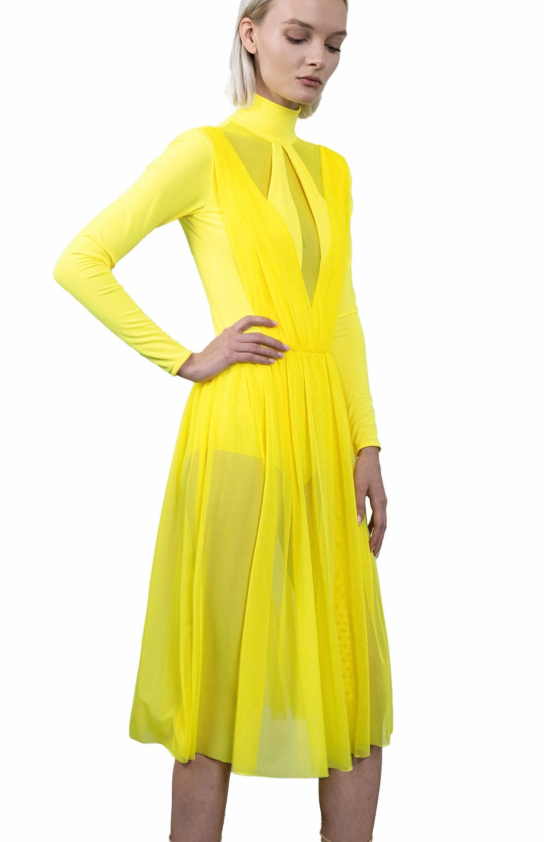 Neon yellow, ballerina style, bodysuit dress, with long sleeves, turtleneck and gathered sheer skirt below the knee.