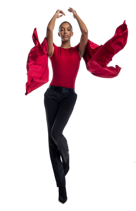 stylish, red draped bodysuit with shoulder pads and oversized cape sleeves