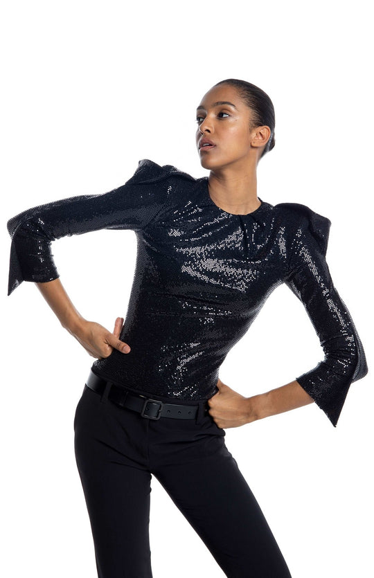 Black, high shoulder, sequin bodysuit, with draped sleeves, closed neck and high shoulderpads.