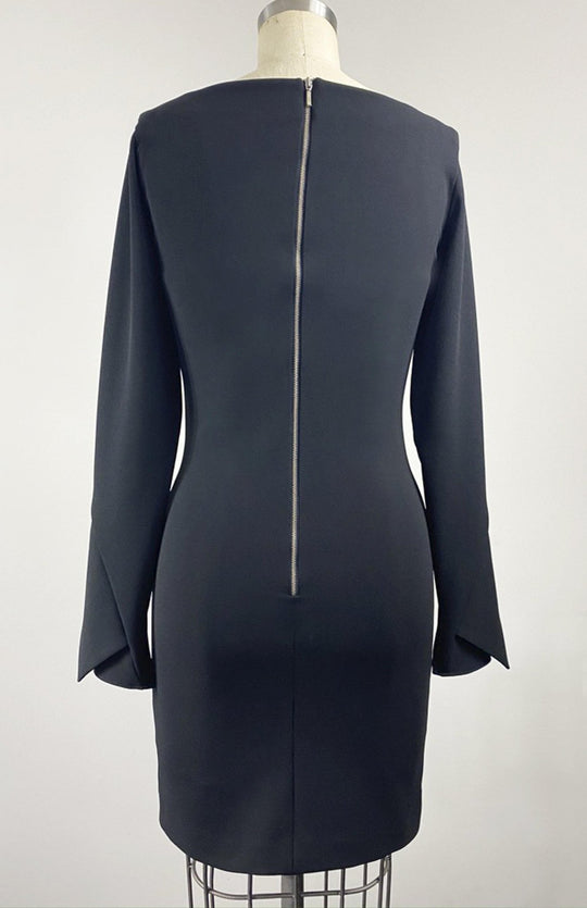 Back view of perfect little black dress. Long sleeve short fitted dress, with high neck, long sleeves, made in stretch crepe.