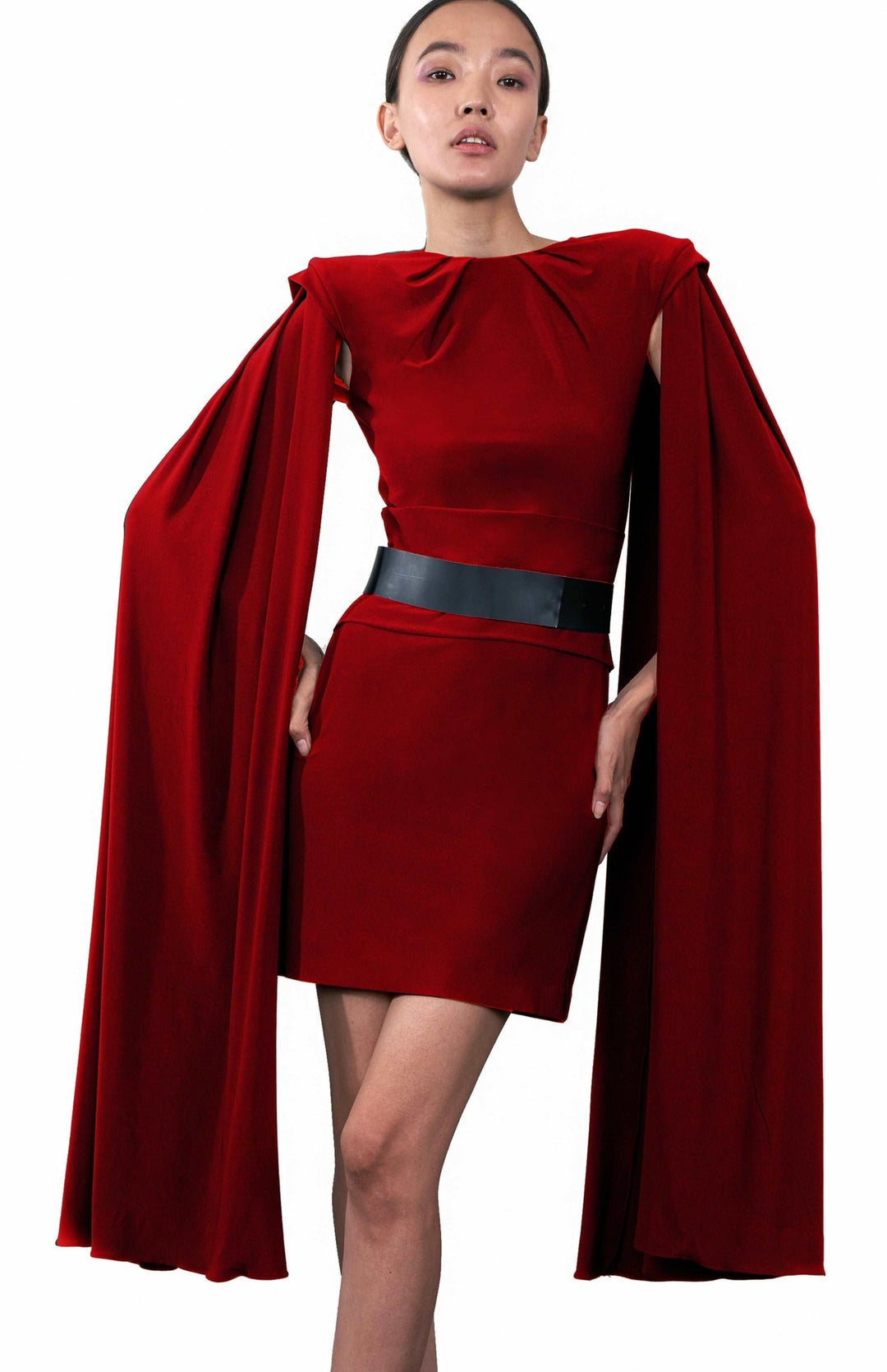  Short, red ,cape sleeve dress in jersey knit with shoulder pads and pleated detail.