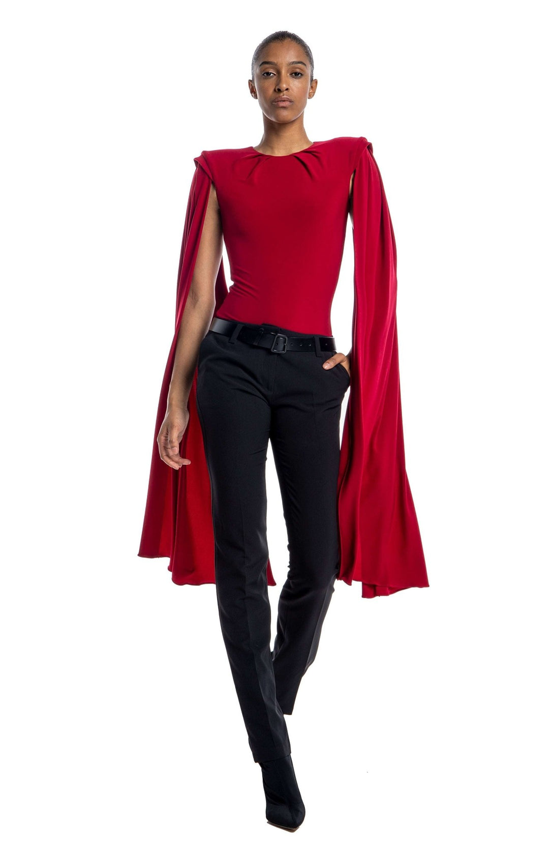 chic, red draped bodysuit with shoulder pads and oversized cape sleeves