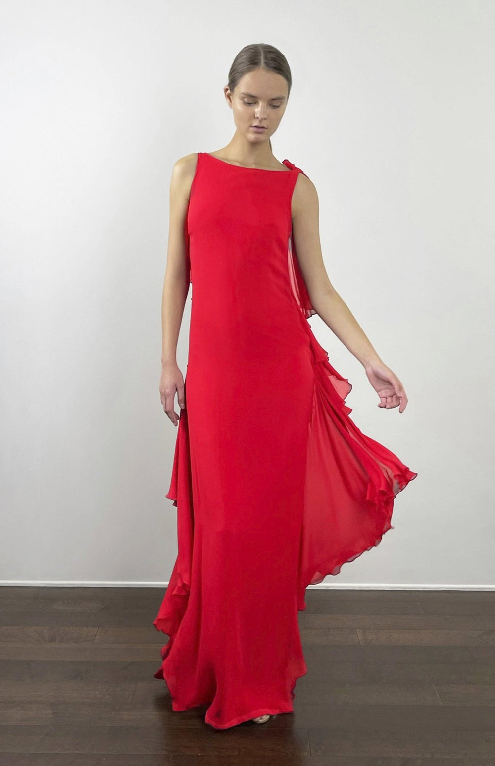 Limited edition red long evening dress or red carpet gown in silk georgette with sheer back and draped frills 